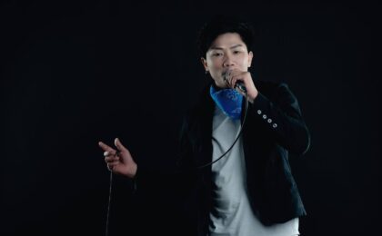 singer holding microphone and singing